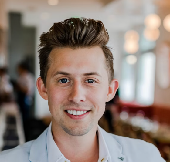 Man in light blue shirt